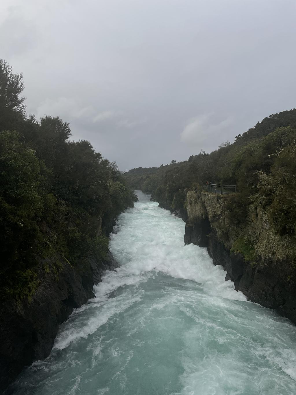 A vigorous stream leading to the cliff of Huka falls